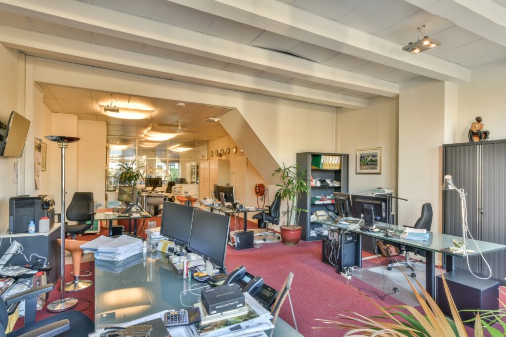 A spacious workspace full of office items and equipment in the concept of 'What Are the Factors Influencing the Cost of Office Removals in Walthamstow'.